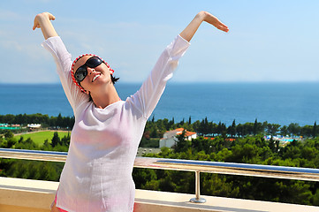 Image showing Young pretty woman enjoying the sun