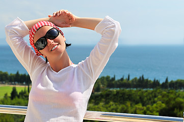 Image showing Young pretty woman enjoying the sun