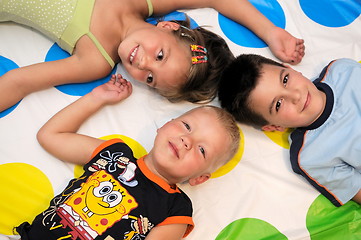 Image showing Happy three kids playing together