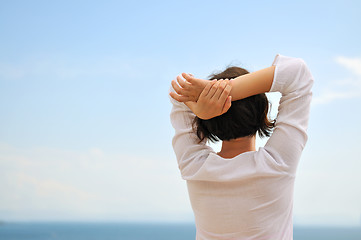 Image showing Young pretty woman enjoying the sun