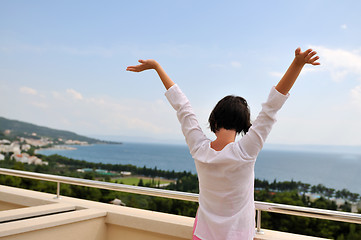 Image showing Young pretty woman enjoying the sun