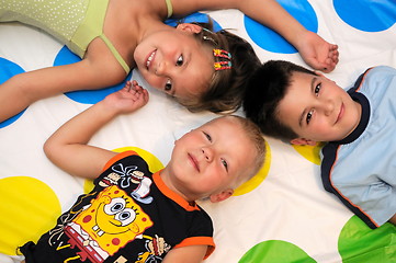 Image showing Happy three kids playing together