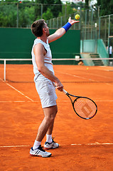 Image showing One man play tennis outdoors