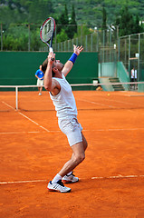 Image showing One man play tennis outdoors