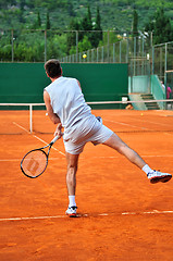 Image showing One man play tennis outdoors