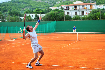 Image showing One man play tennis outdoors