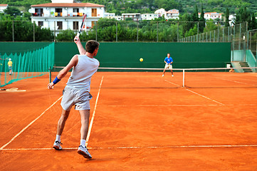 Image showing Man plays tennis outdoors