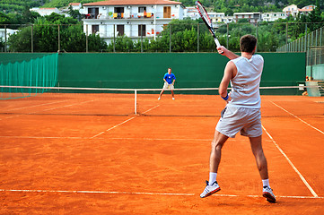 Image showing Man plays tennis outdoors