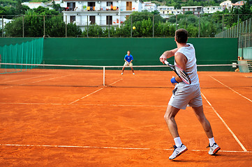 Image showing Man plays tennis outdoors