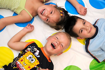 Image showing Happy three kids playing together