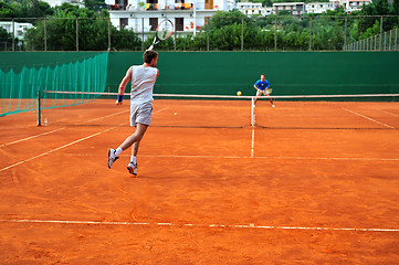 Image showing Man plays tennis outdoors