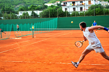 Image showing Man plays tennis outdoors