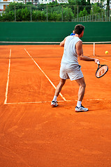 Image showing Man plays tennis outdoors