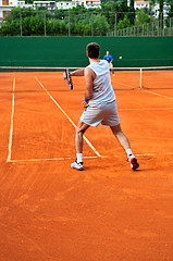 Image showing Man plays tennis outdoors