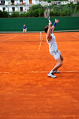 Image showing Man plays tennis outdoors