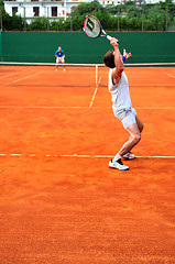 Image showing Man plays tennis outdoors