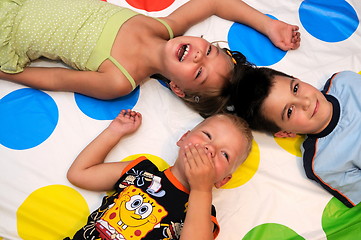 Image showing Happy three kids playing together