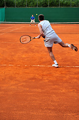 Image showing One man play tennis outdoors