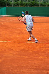 Image showing One man play tennis outdoors