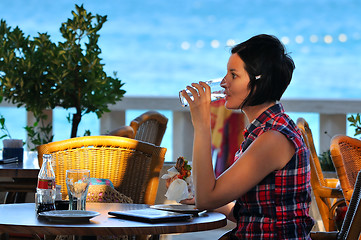 Image showing Young lady having dinner