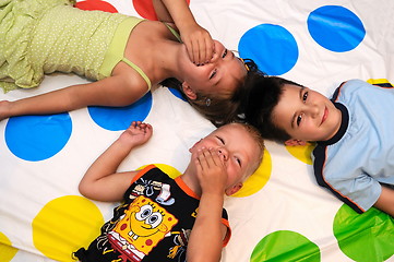 Image showing Happy three kids playing together