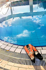 Image showing Scuba on the edge of outdoor pool