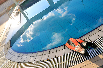 Image showing Scuba on the edge of outdoor pool