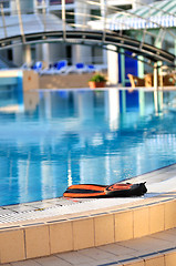 Image showing Scuba on the edge of outdoor pool