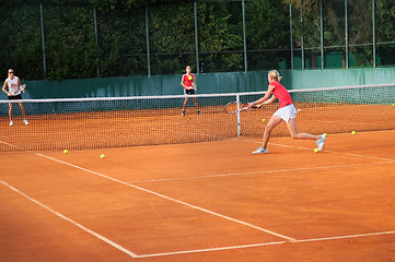 Image showing Girl playing tennis outdoor