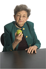 Image showing senior woman with apple