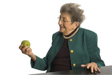 Image showing senior woman with apple