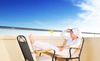 Image showing young girl siting in chair, juice, drink, fresh, orange, healthy