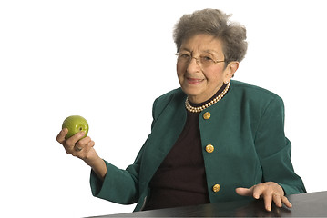 Image showing senior woman with apple