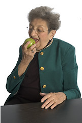 Image showing senior woman with apple