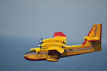 Image showing Airplane on sea taking water