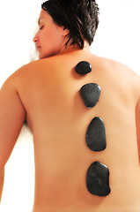 Image showing beautiful woman have hotstone massage at spa and wellness center
