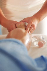 Image showing foot and leg massage at the spa and wellness center