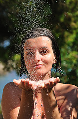 Image showing young pretty woman relaxing under shower