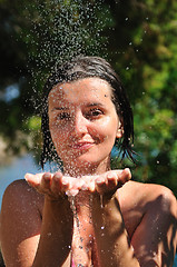 Image showing young pretty woman relaxing under shower