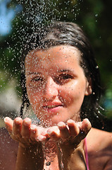 Image showing young pretty woman relaxing under shower