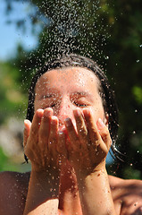 Image showing young pretty woman relaxing under shower