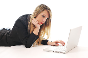 Image showing one young girl work on laptop isolated on white