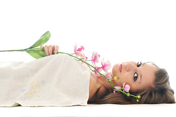 Image showing beautiful young  woman face with flower and towel