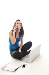 Image showing one young girl work on laptop isolated on white