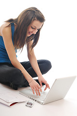 Image showing one young girl work on laptop isolated on white