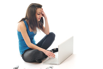 Image showing one young girl work on laptop isolated on white