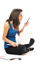 Image showing one young girl work on laptop isolated on white