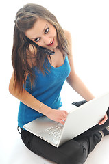 Image showing one young girl work on laptop isolated on white