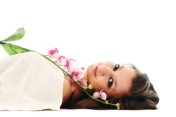 Image showing beautiful young  woman face with flower and towel