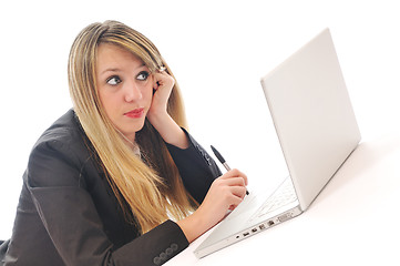 Image showing one young girl work on laptop isolated on white